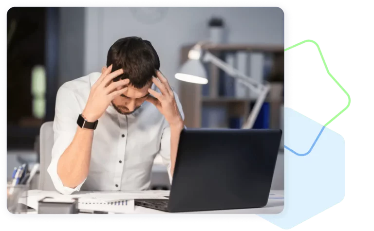 Frustrated businessman in front of a computer